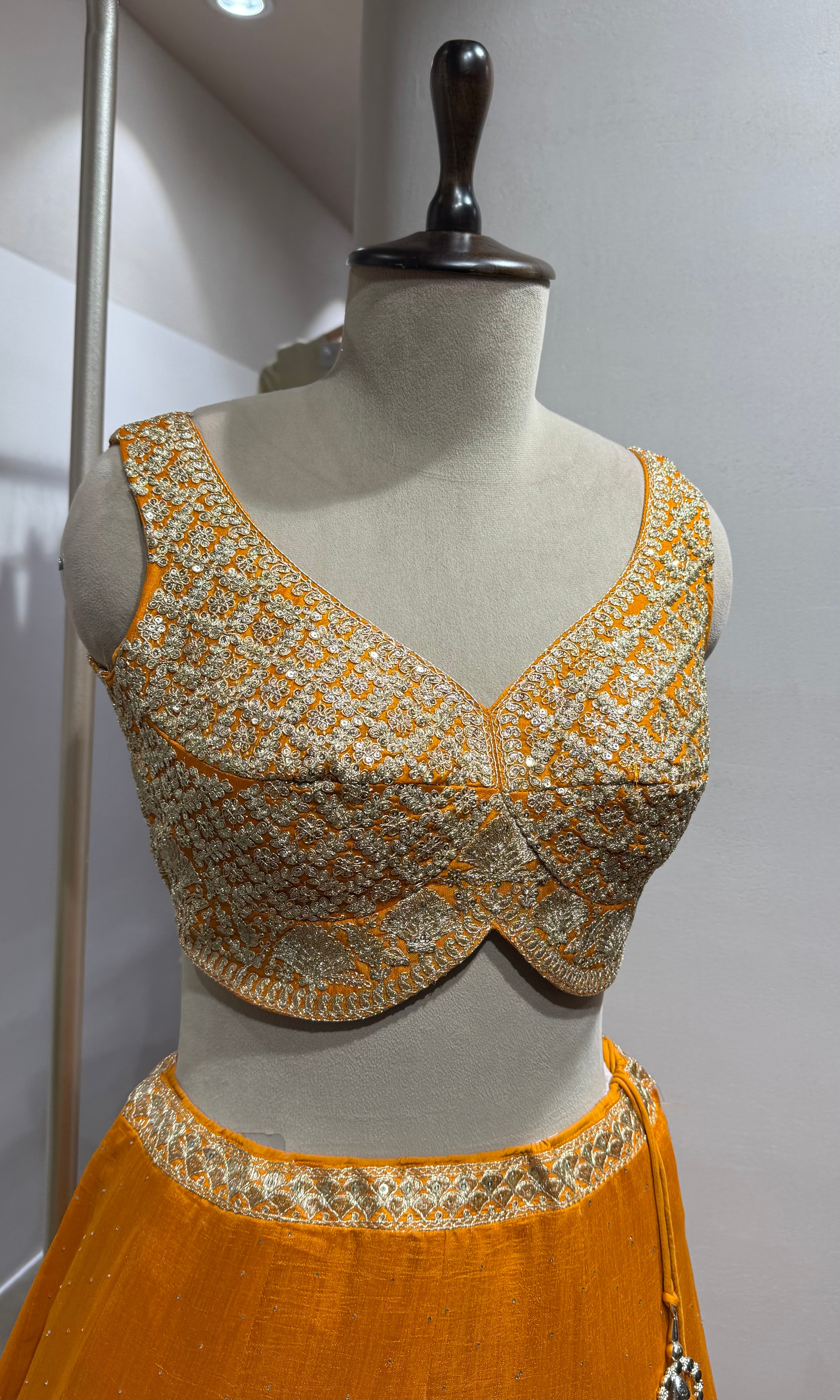 orange silk lehenga set with gold embroidery