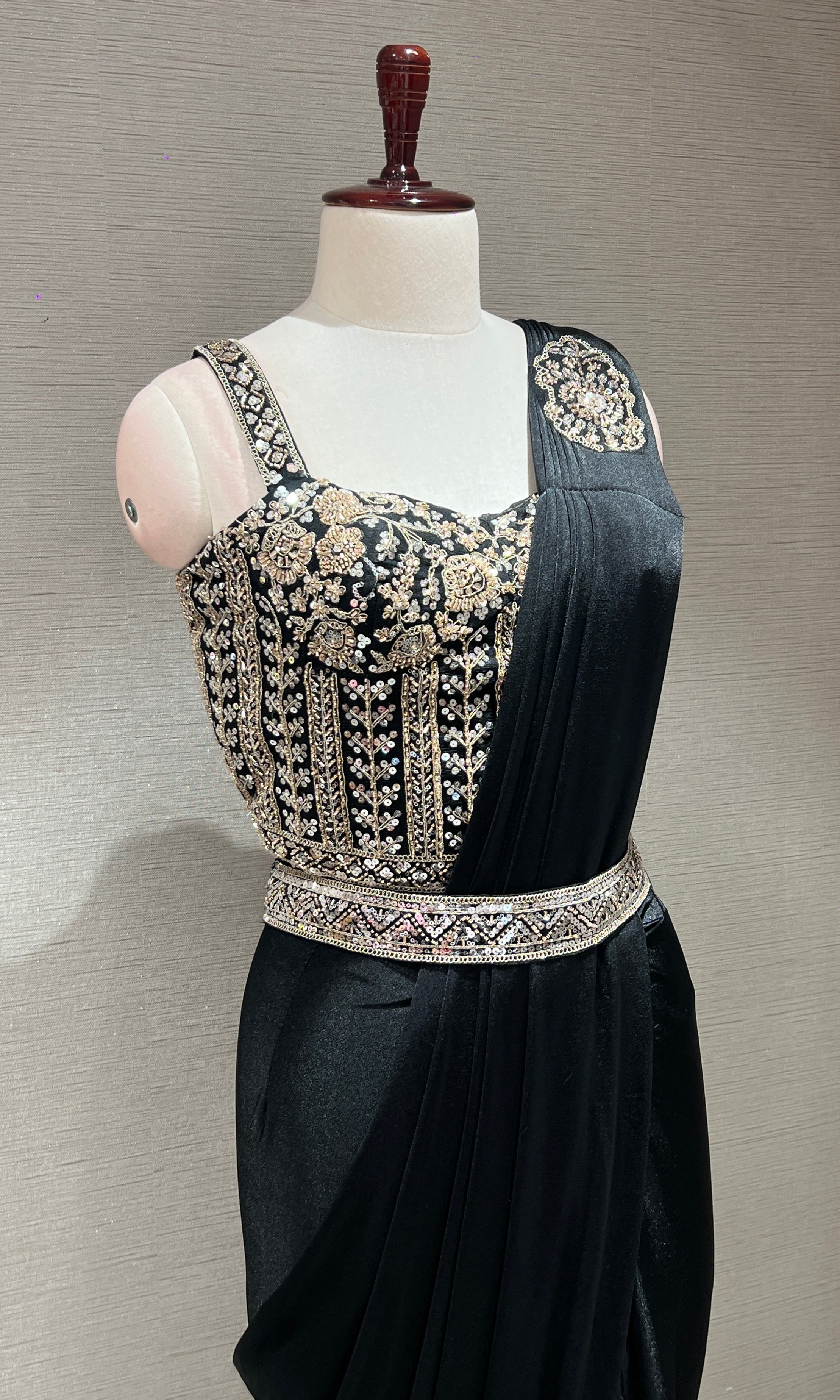 black drape saree with corset blouse and belt
