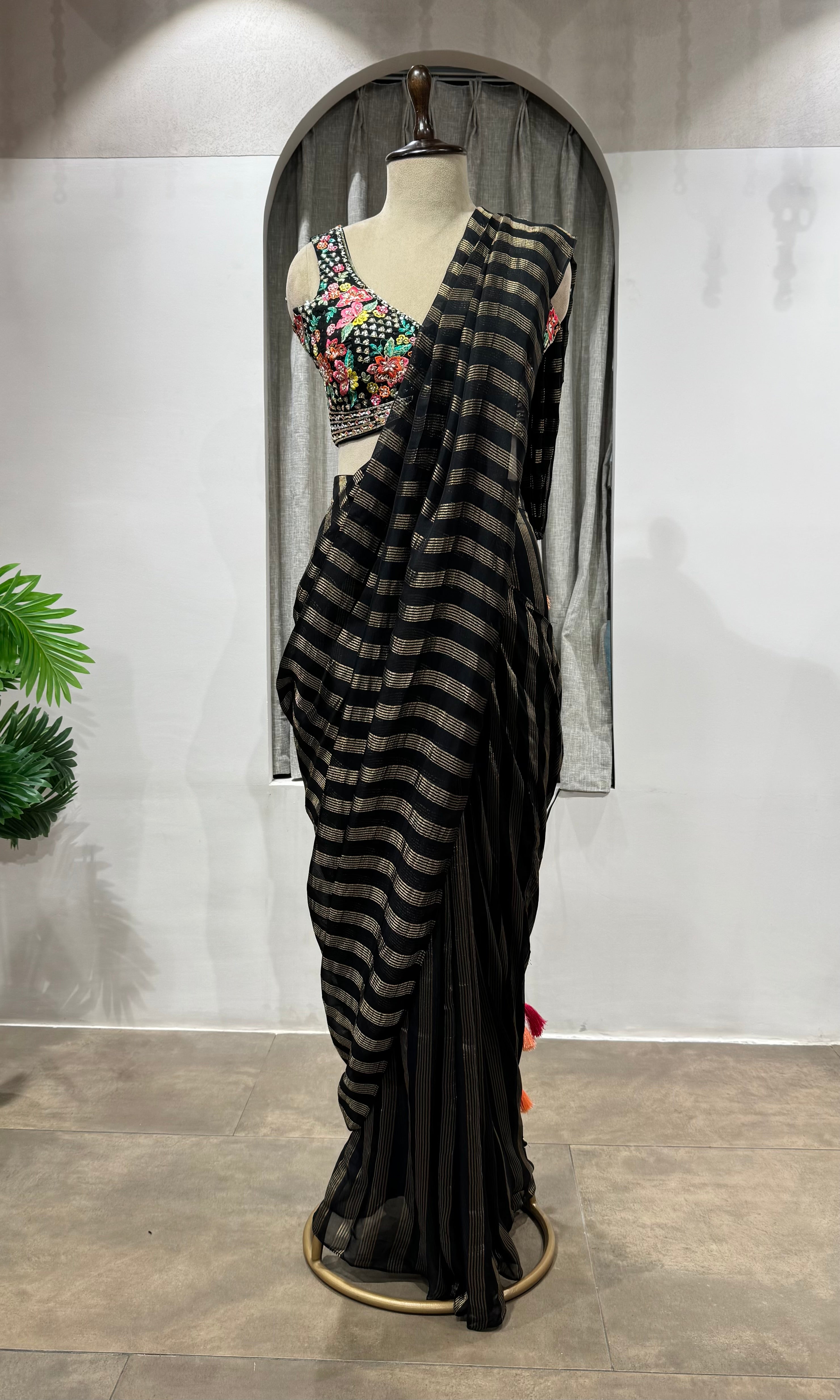 Black and silver striped drape saree with intricate blouse