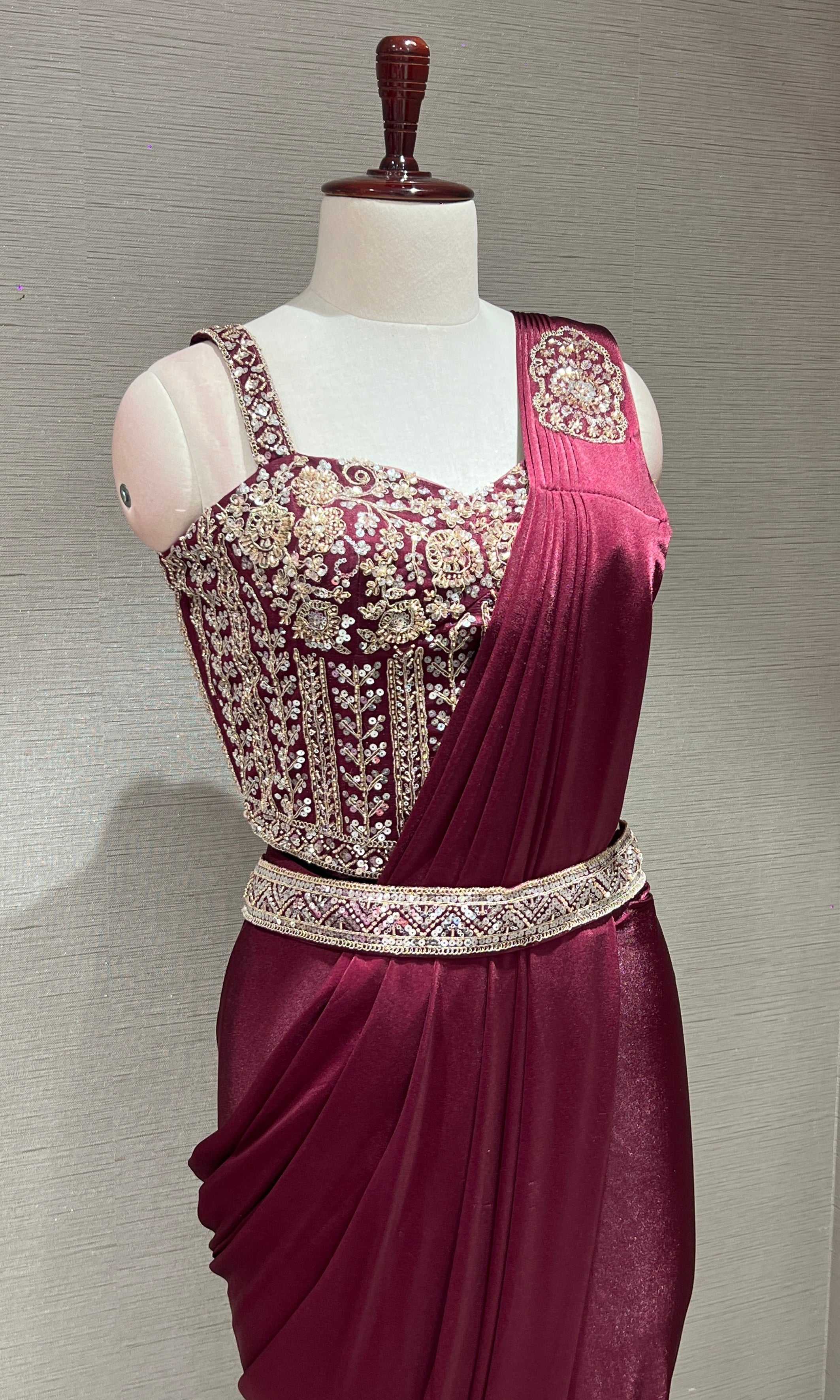wine drape saree with corset blouse and belt