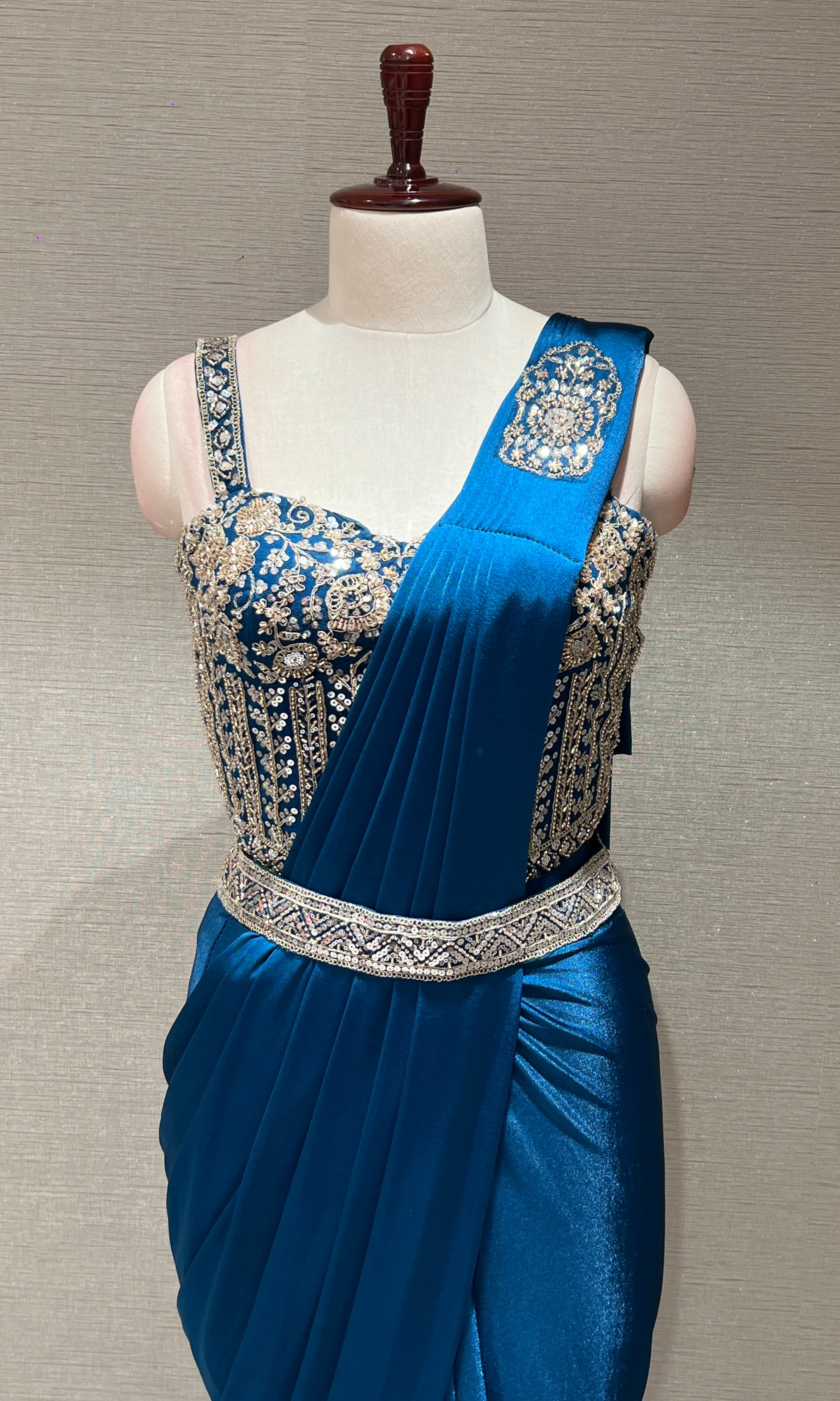 blue drape saree with corset blouse and belt