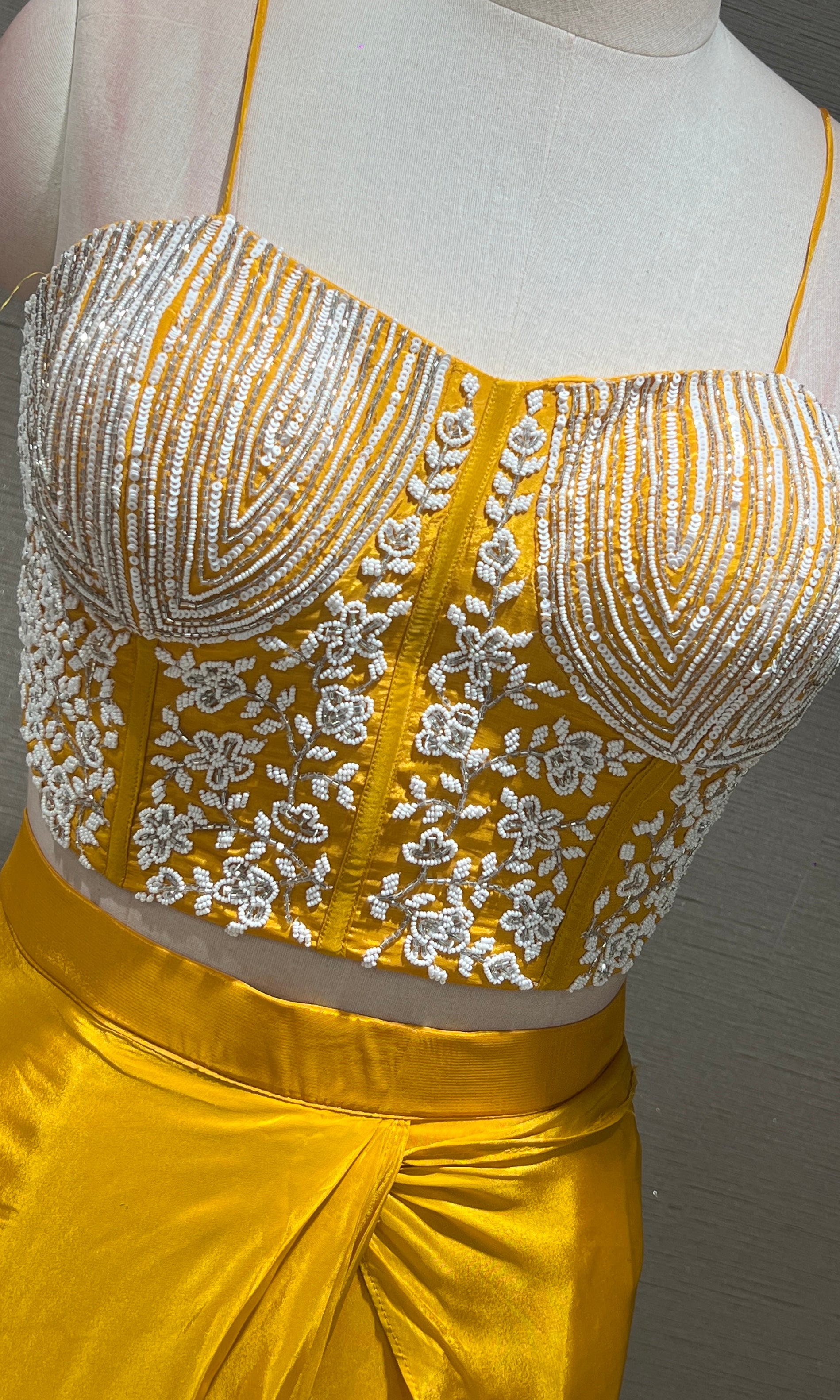 Yellow drape saree with Corset blouse
