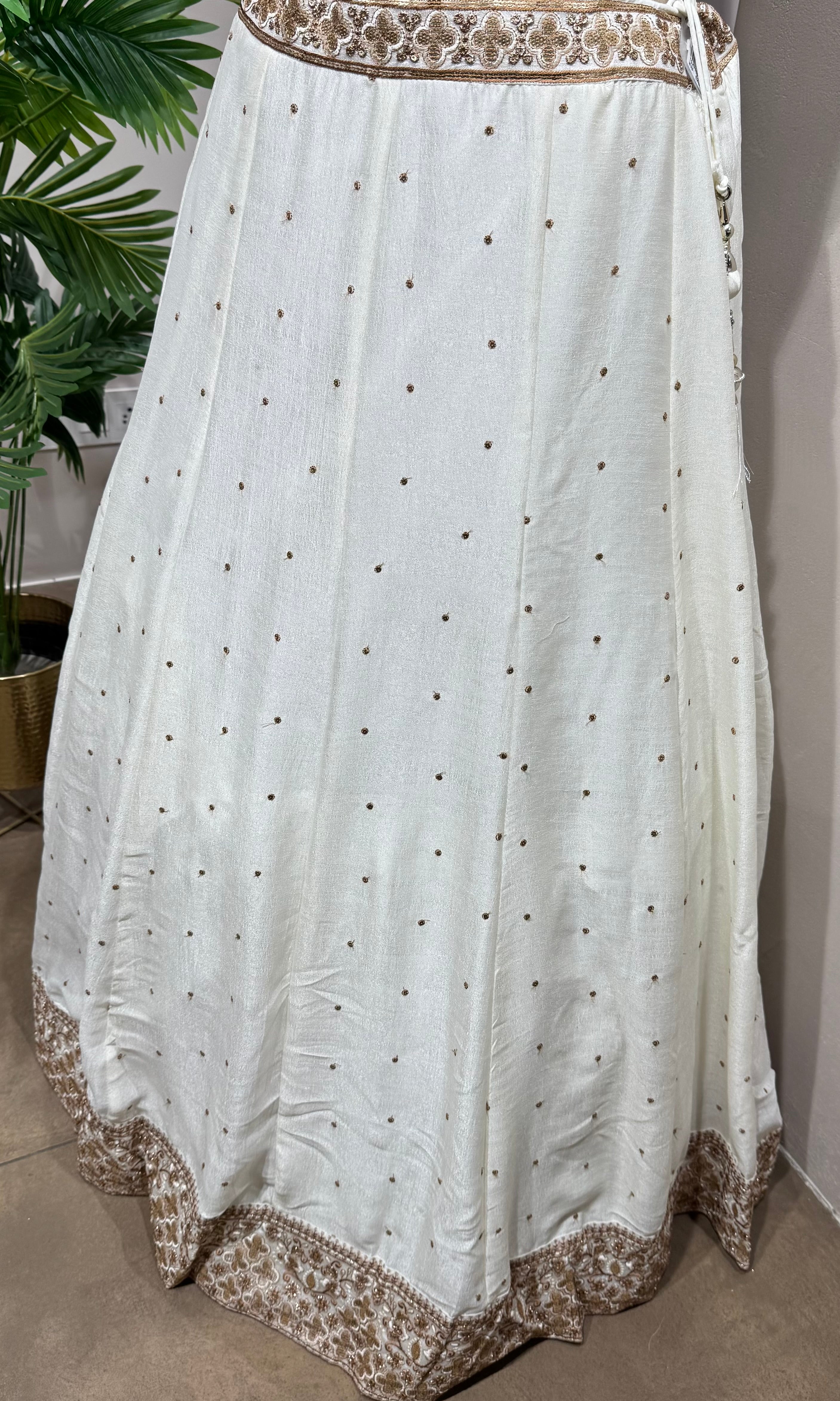 White Lehenga with gold embellished blouse