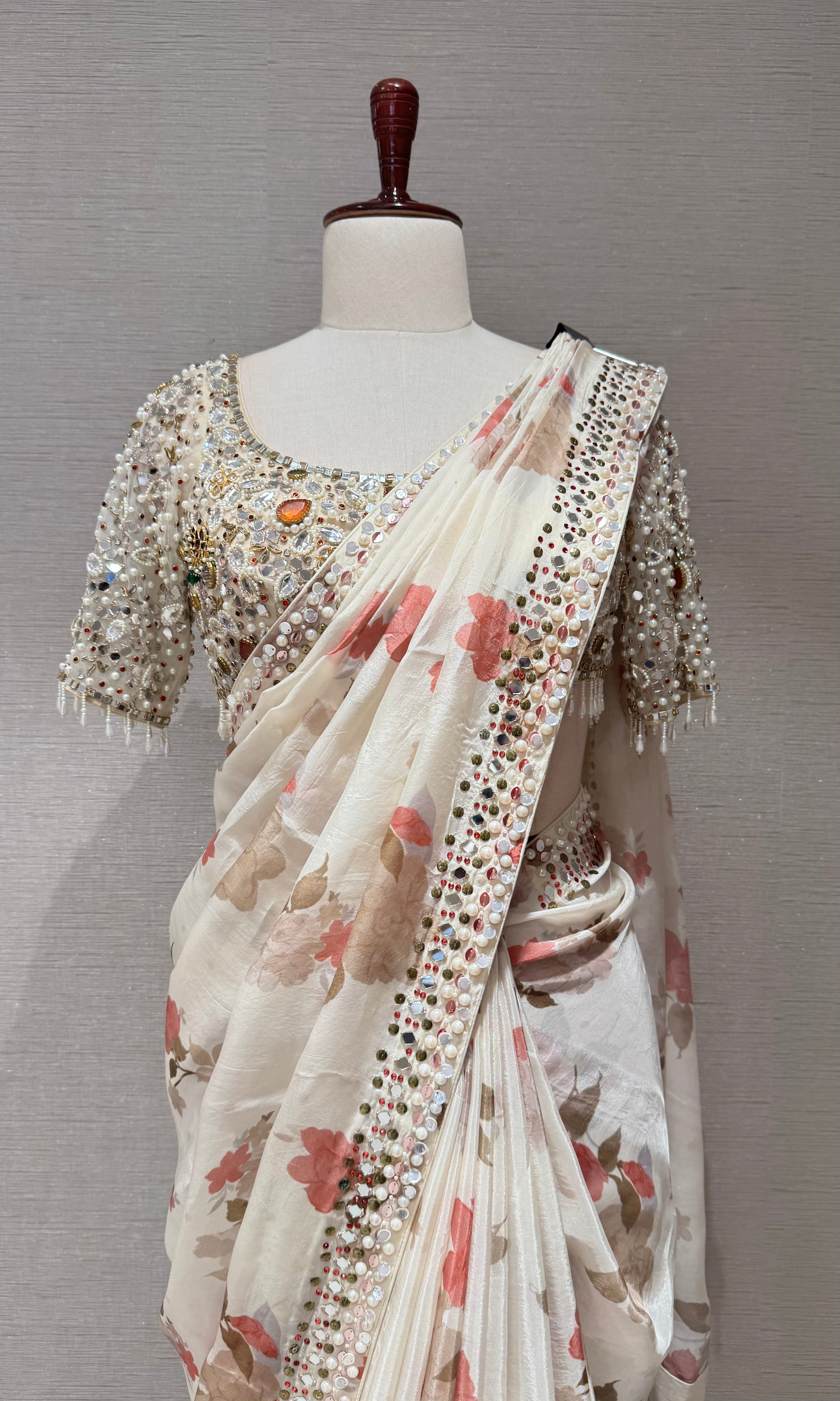 Cream elegant floral saree with embellished blouse