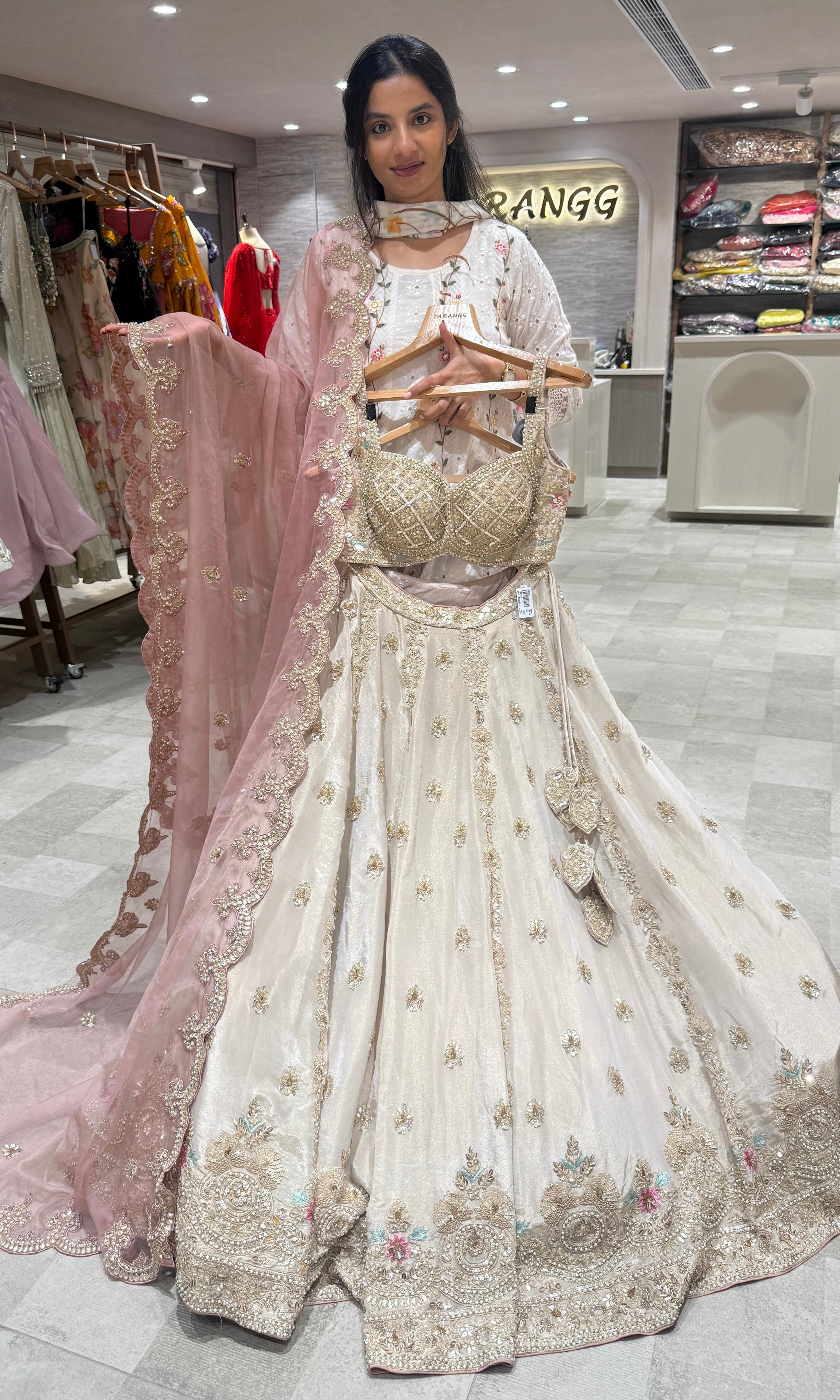 Pearl white lehenga with peachy pink dupatta