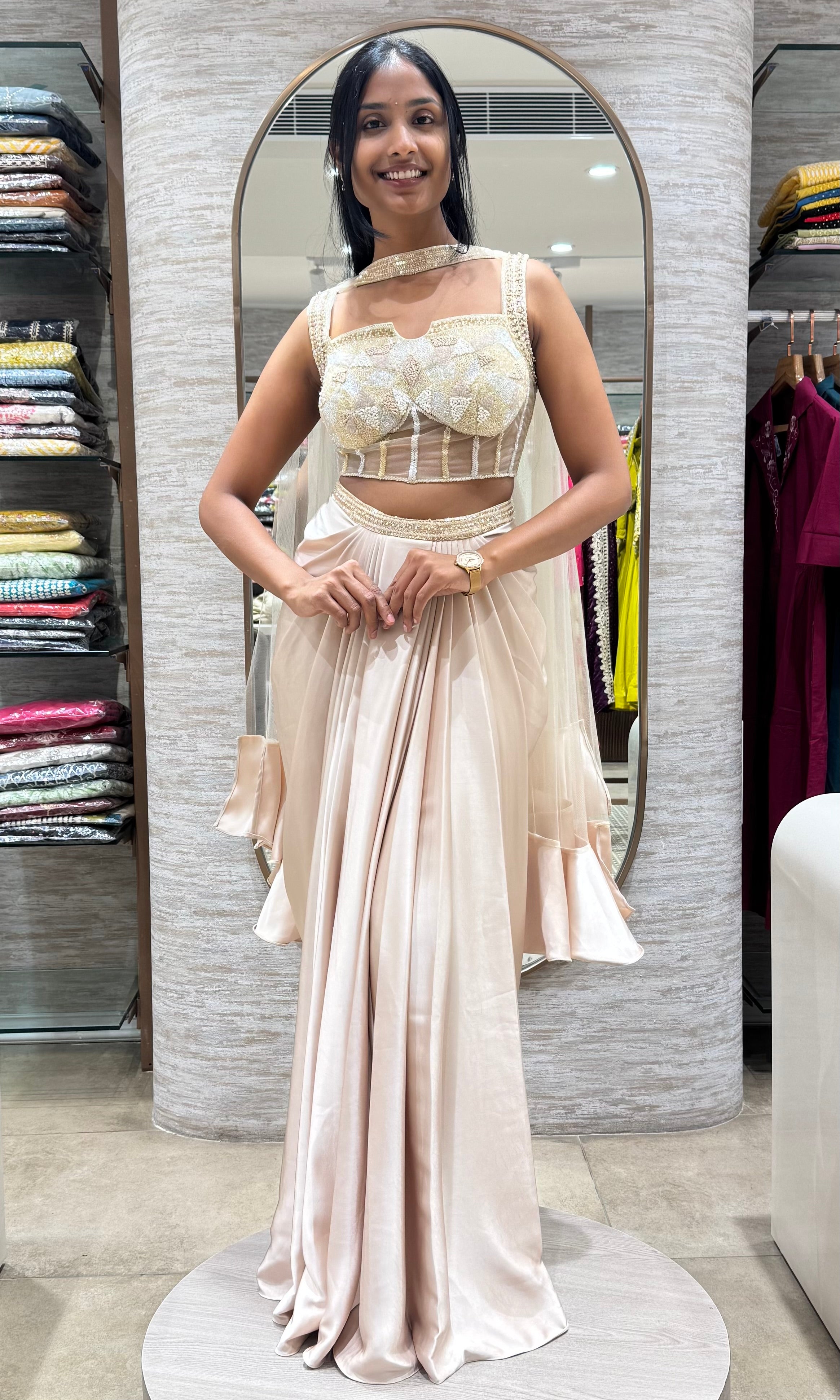 half white drape saree with corset blouse and cape