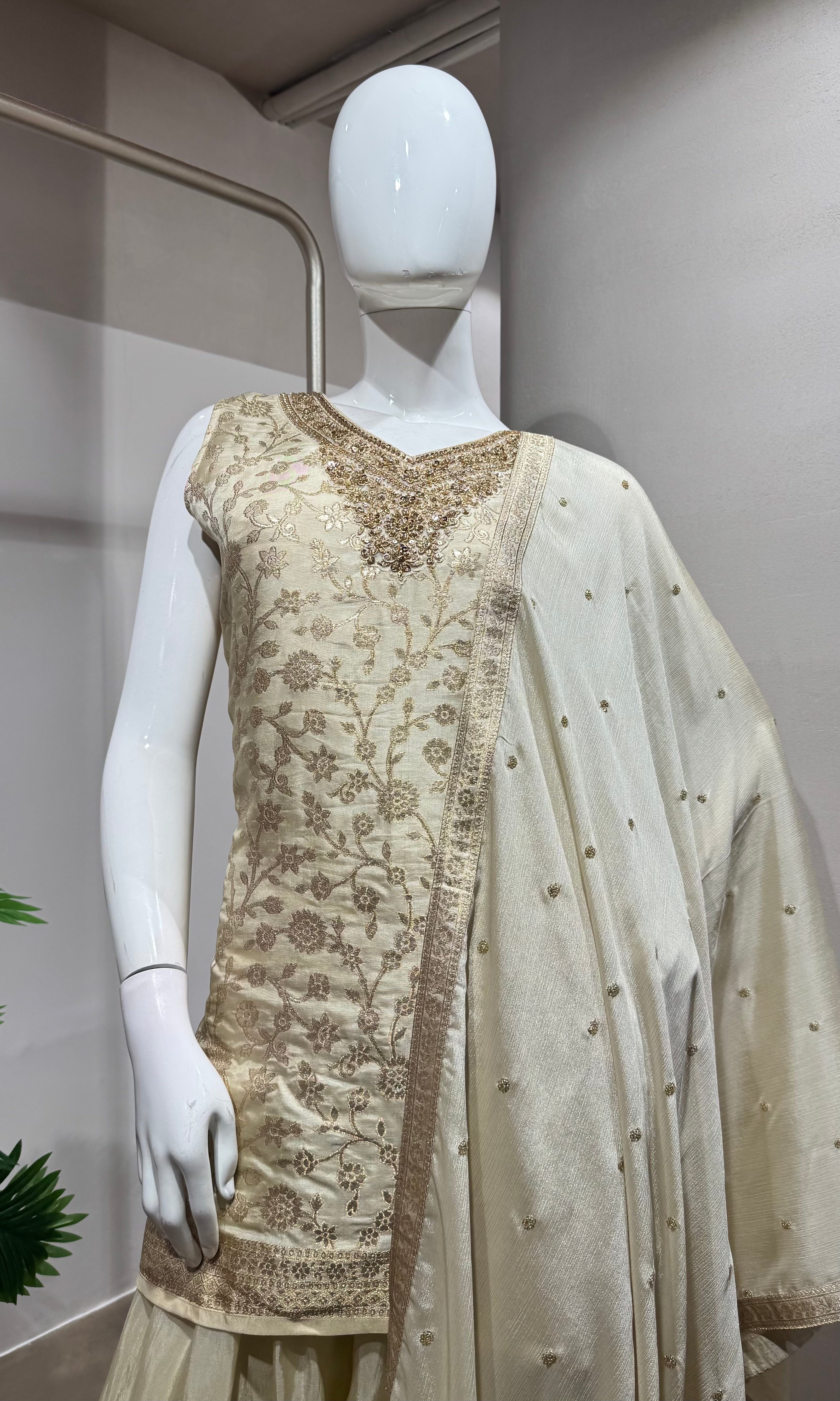 half white kurta set with pants and a dupatta