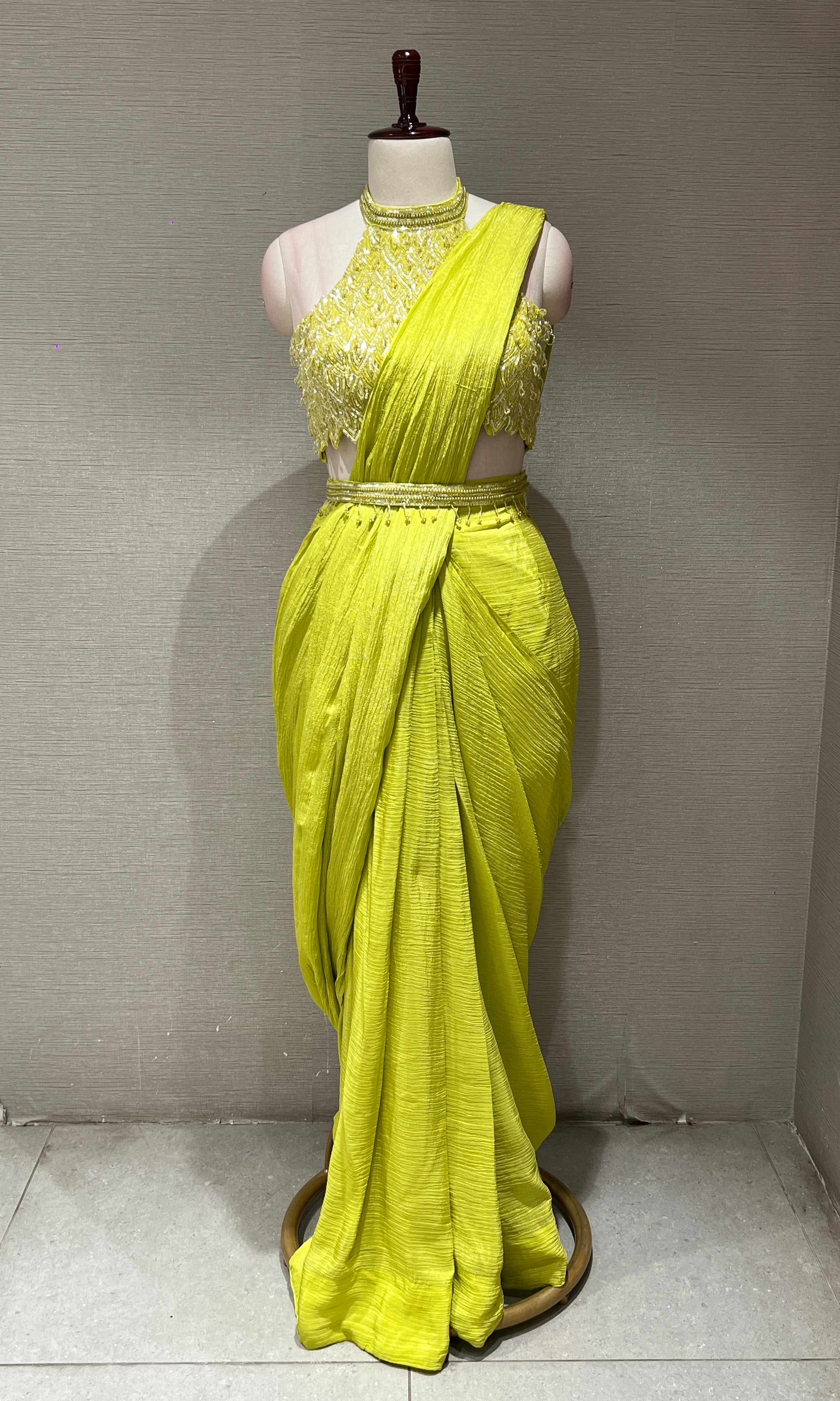 neon green drape saree with halter neck blouse