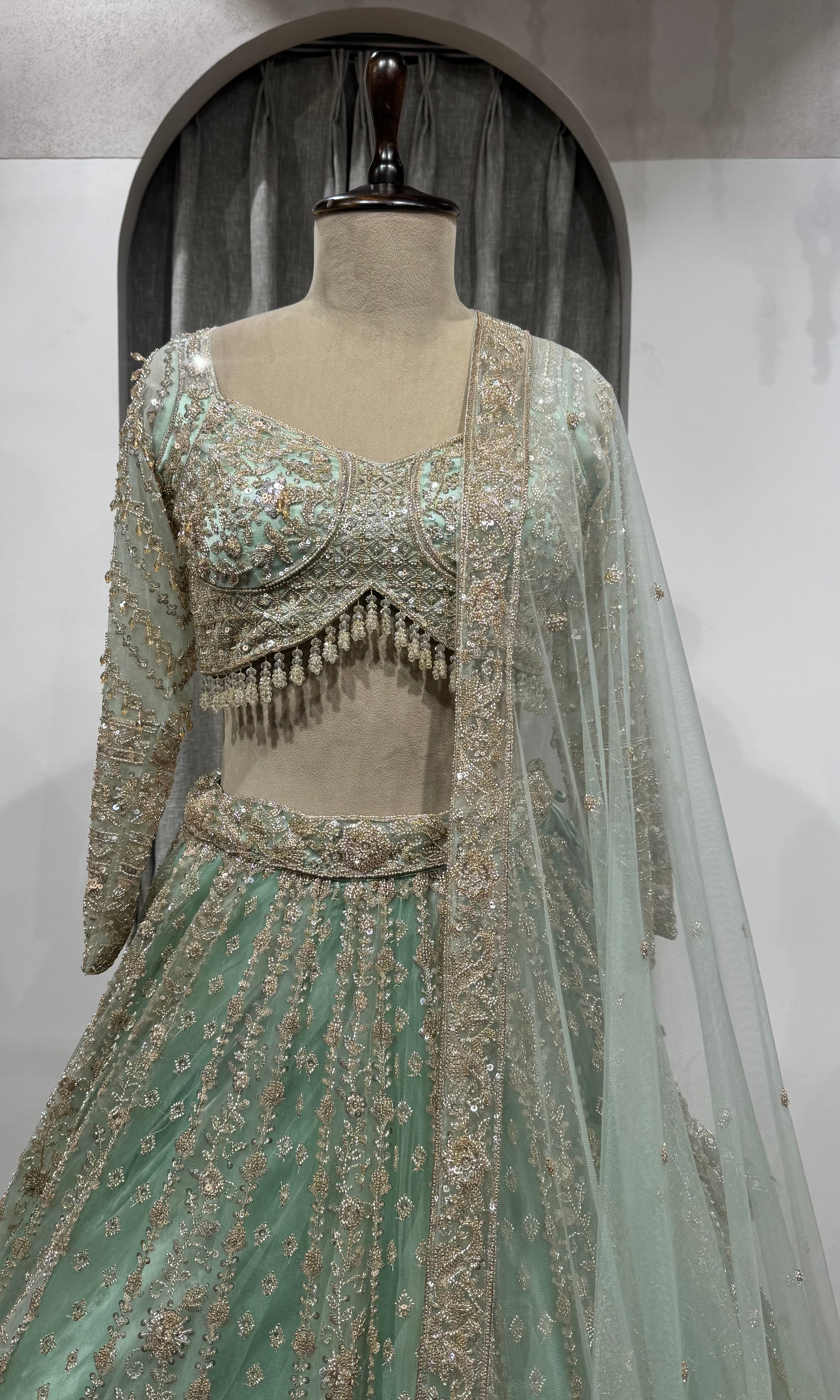 Pista Green Bridal Lehenga with Shimmering Border