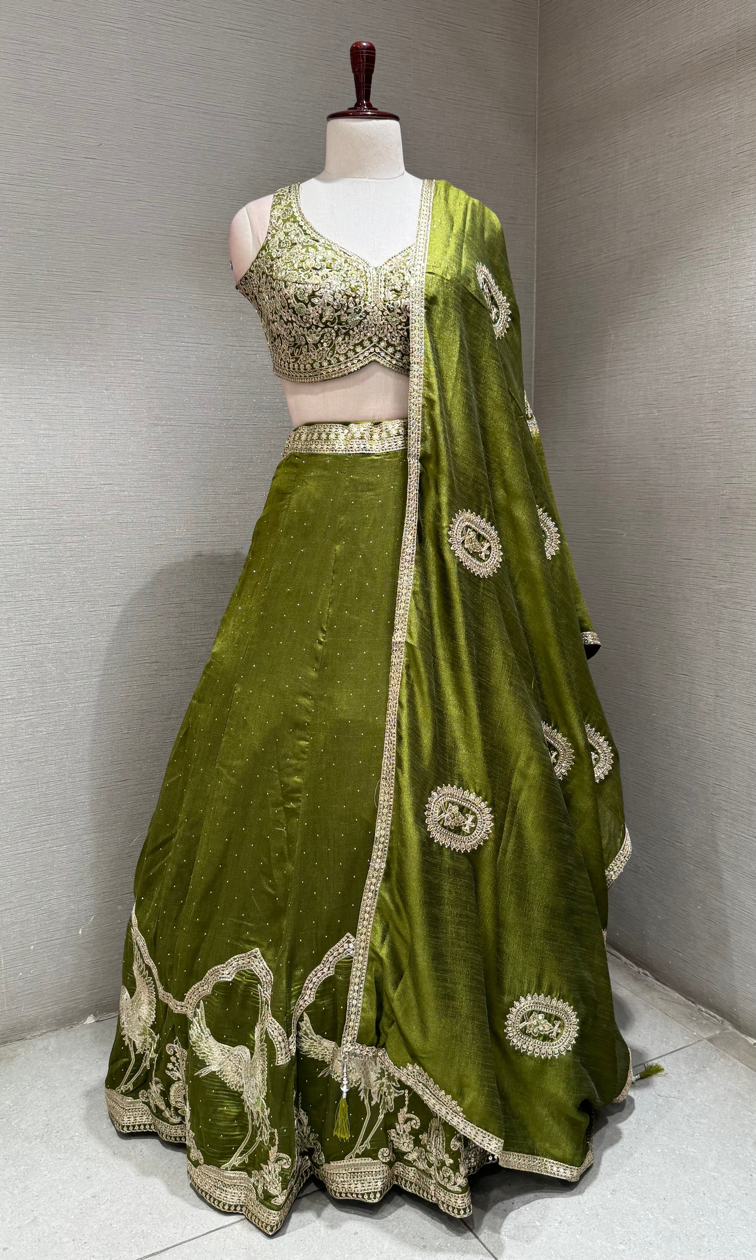 Green Lehenga Choli with Intricate Gold Embroidery