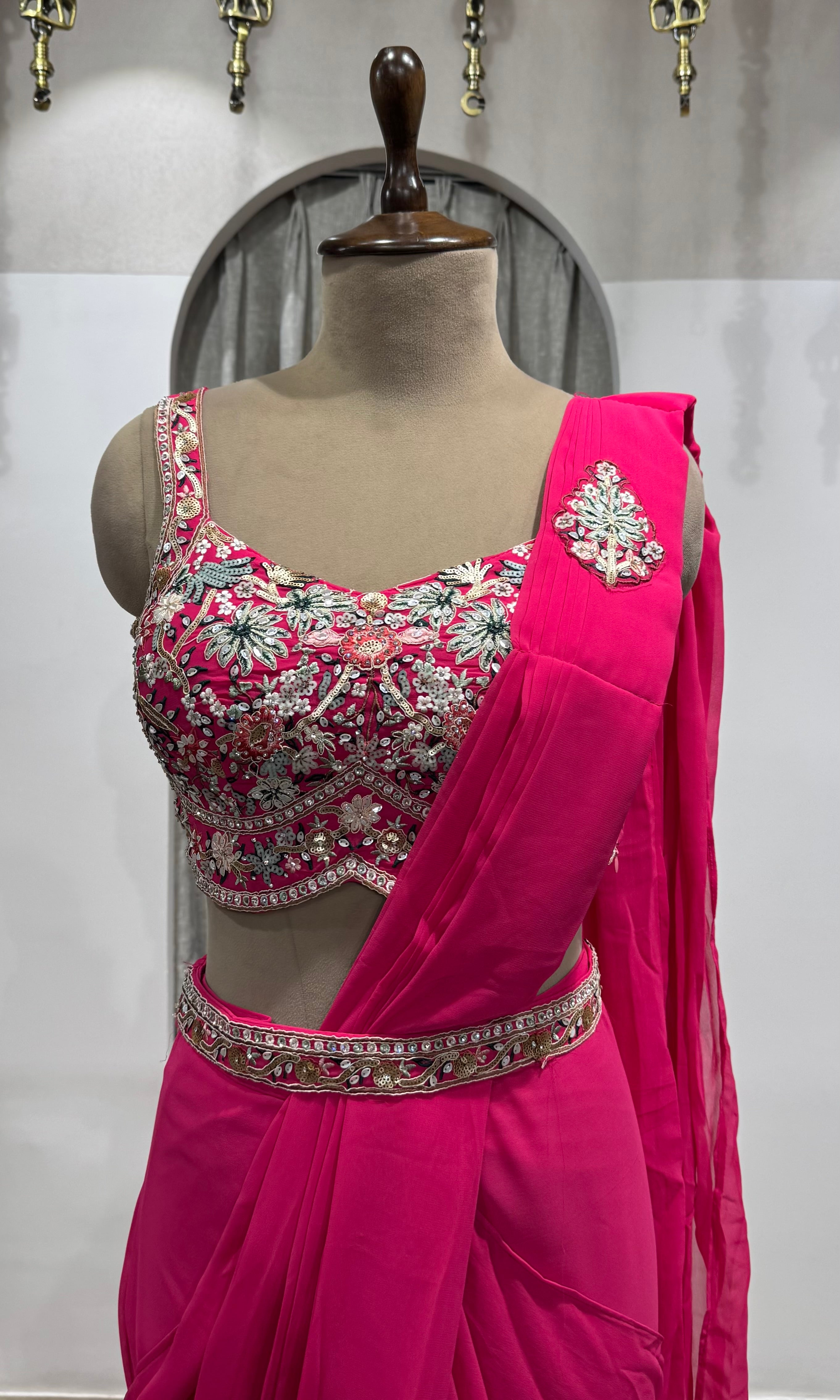 Pink drape saree with floral blouse & belt