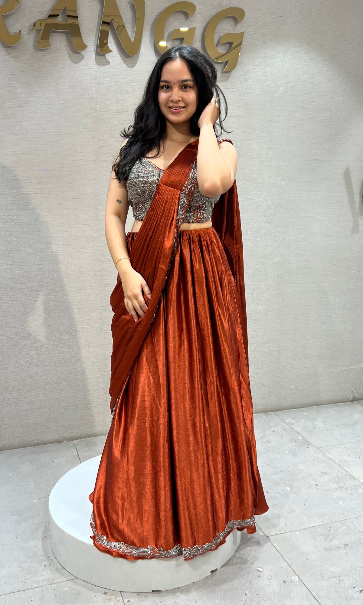 Rust Orange satin Draped lehenga with Silver embroidered Blouse