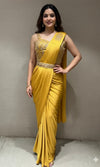 yellow drape saree with corset blouse and belt