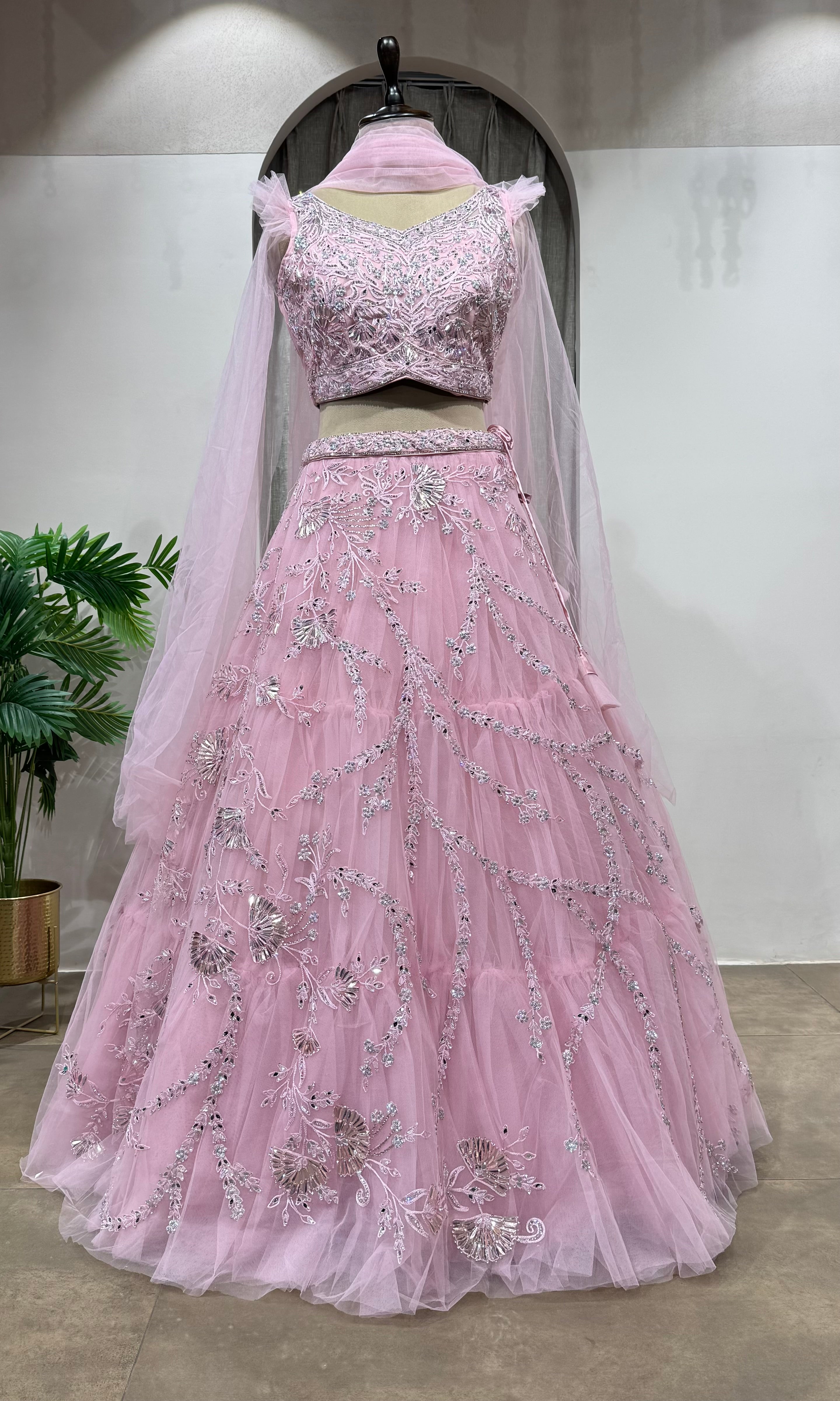 pink floral embroidered net crop top lehenga
