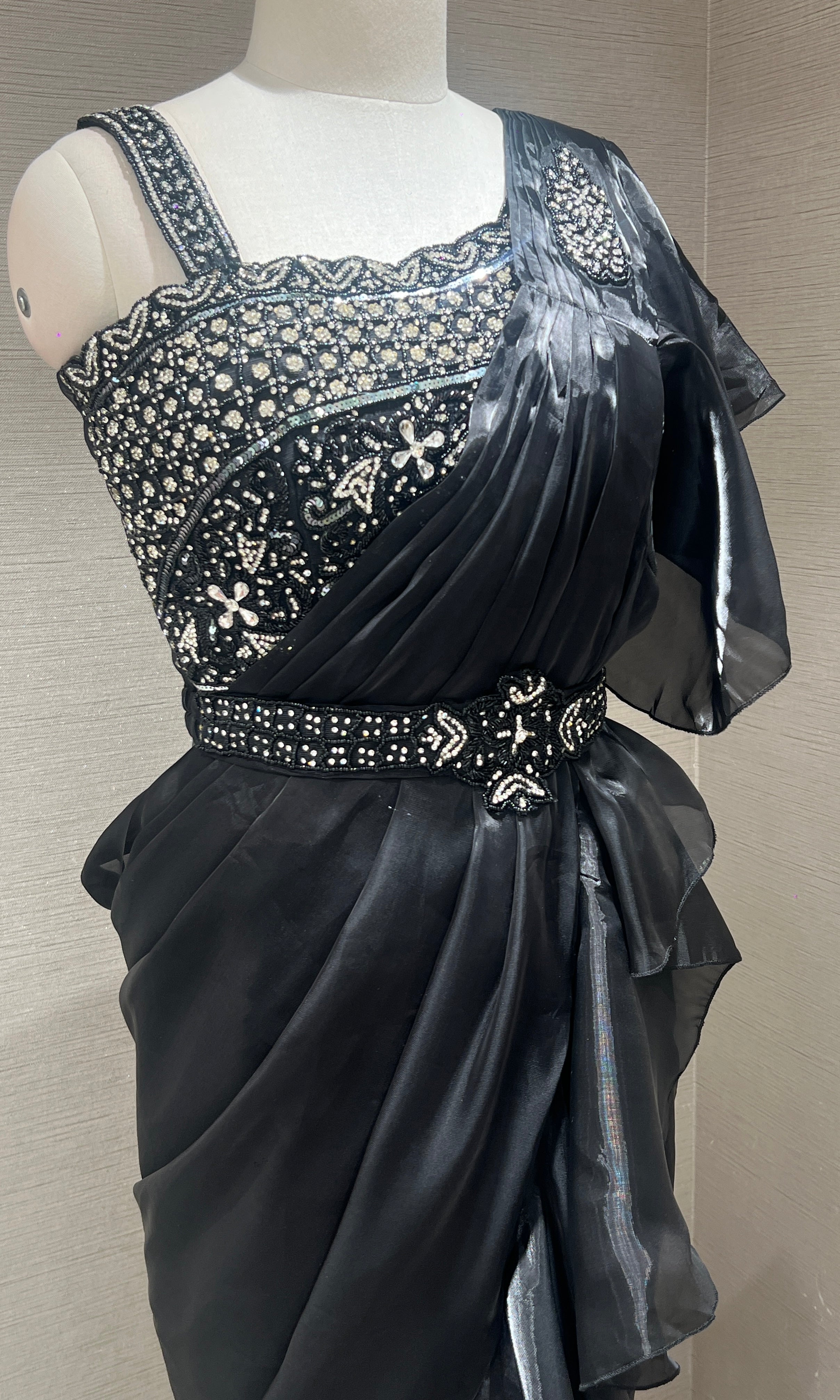 Black ruffle drape saree with embroidered blouse