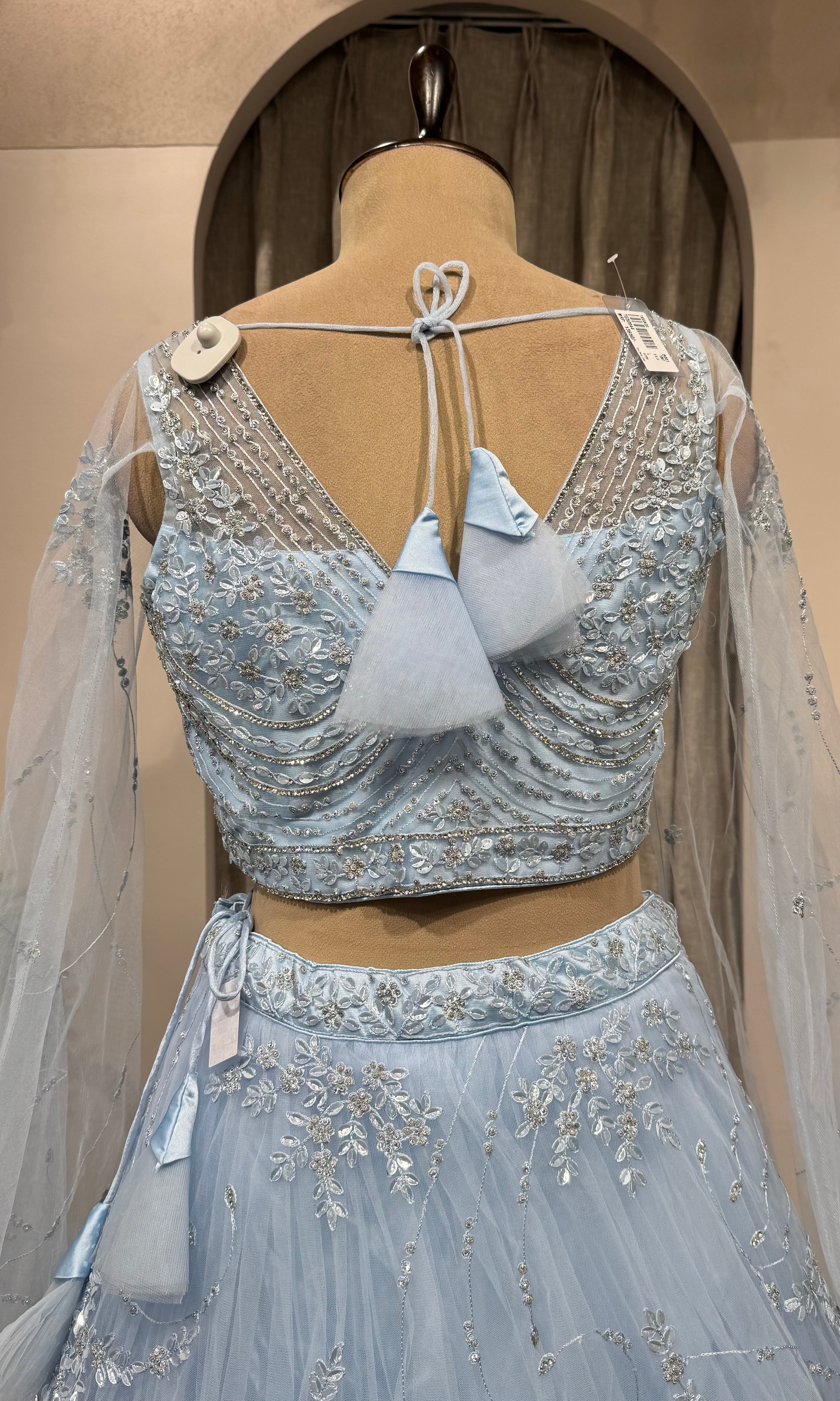blue floral embroidered netted crop top lehenga