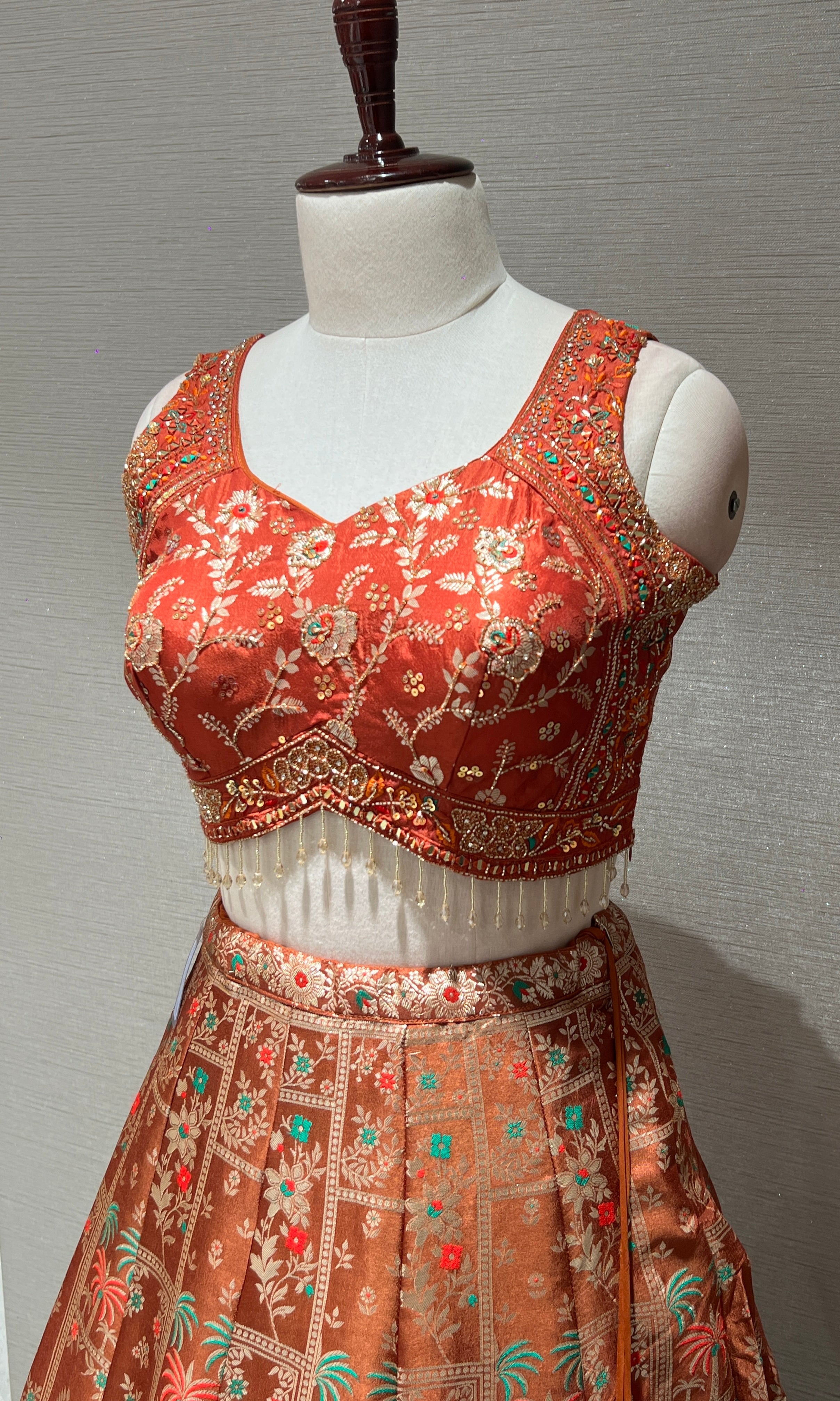 Rust orange Lehenga with Floral and Peacock embroidery