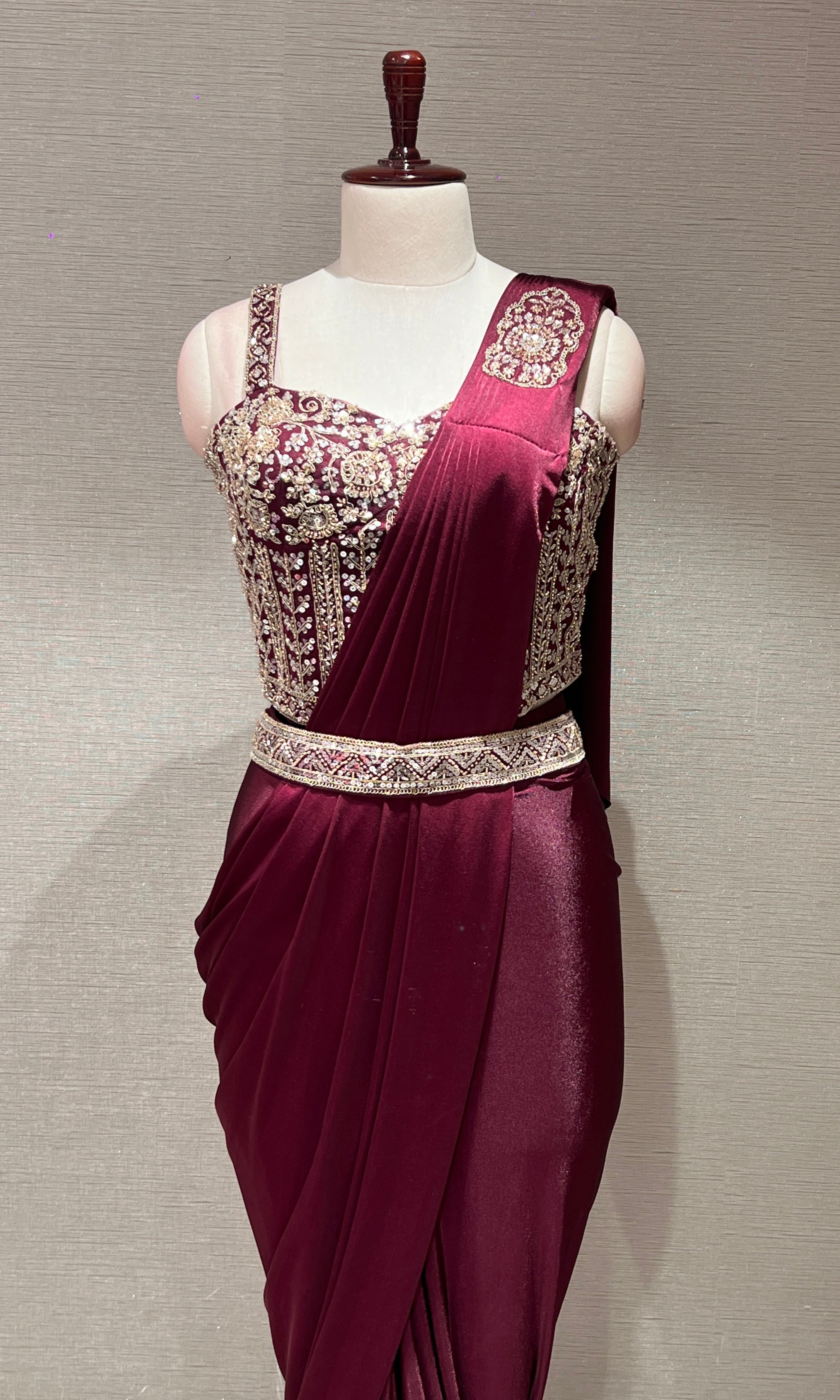 wine drape saree with corset blouse and belt