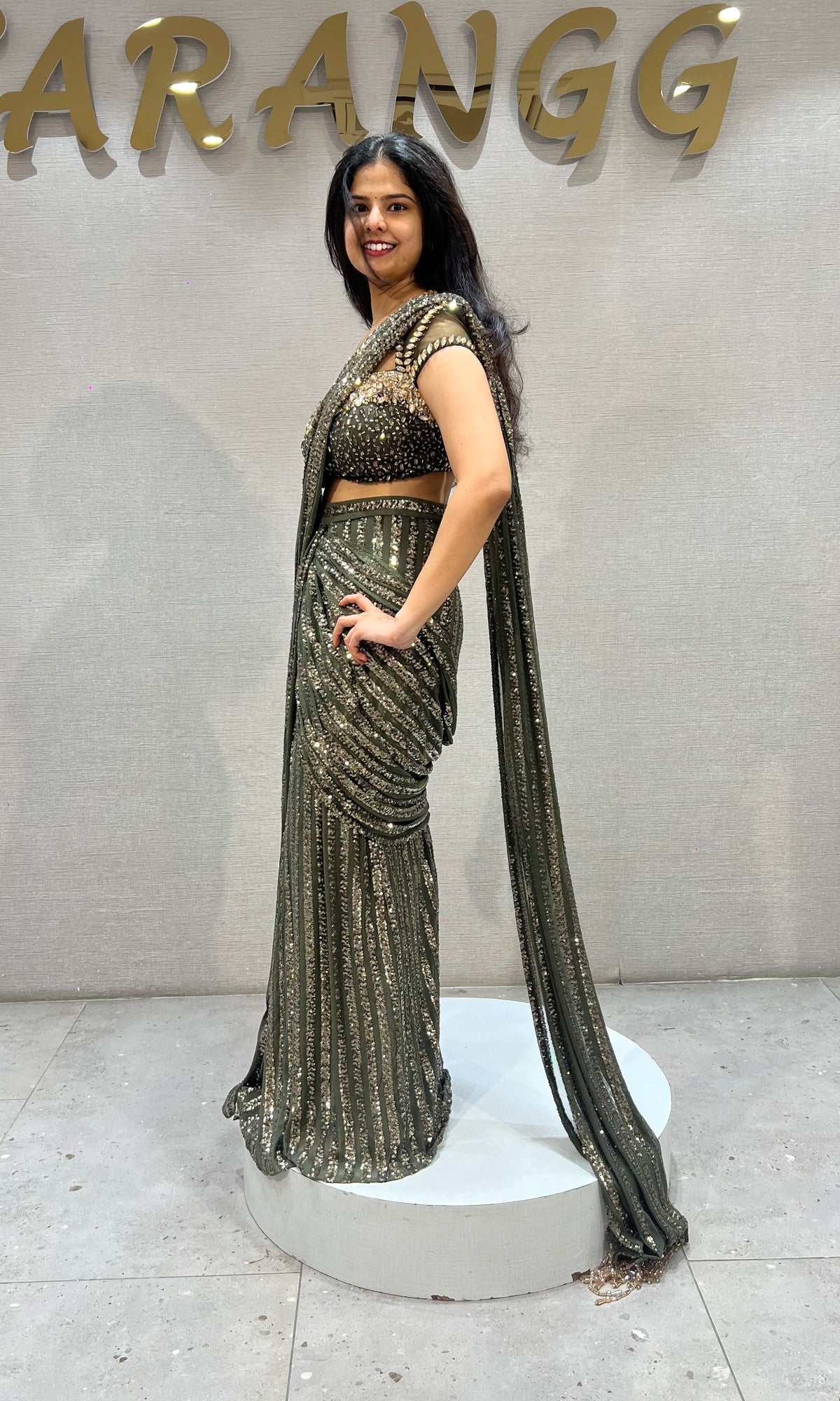 green shimmer metallic drape saree with embellished blouse