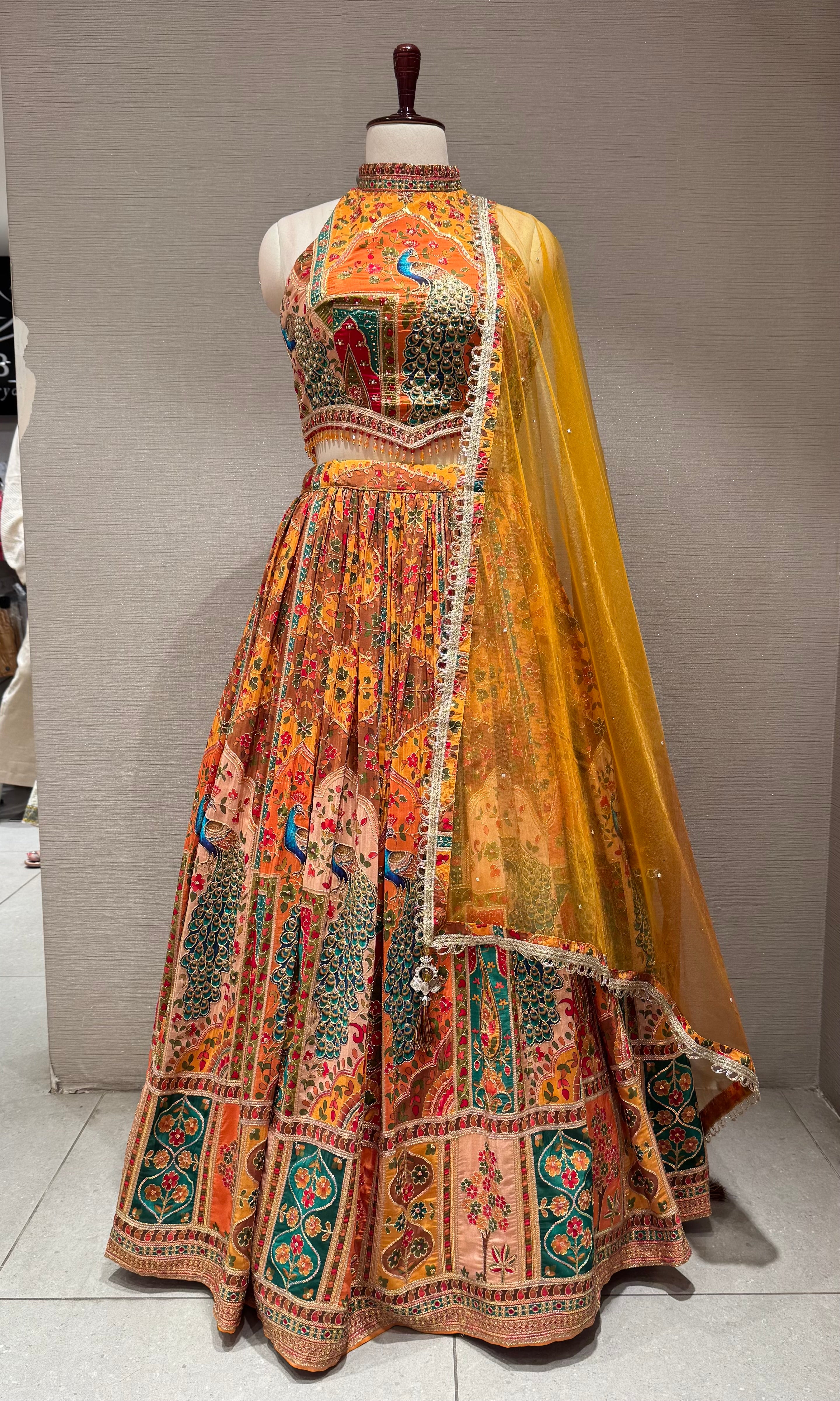 Mustard Mayur Pichwai halter neck Lehenga set