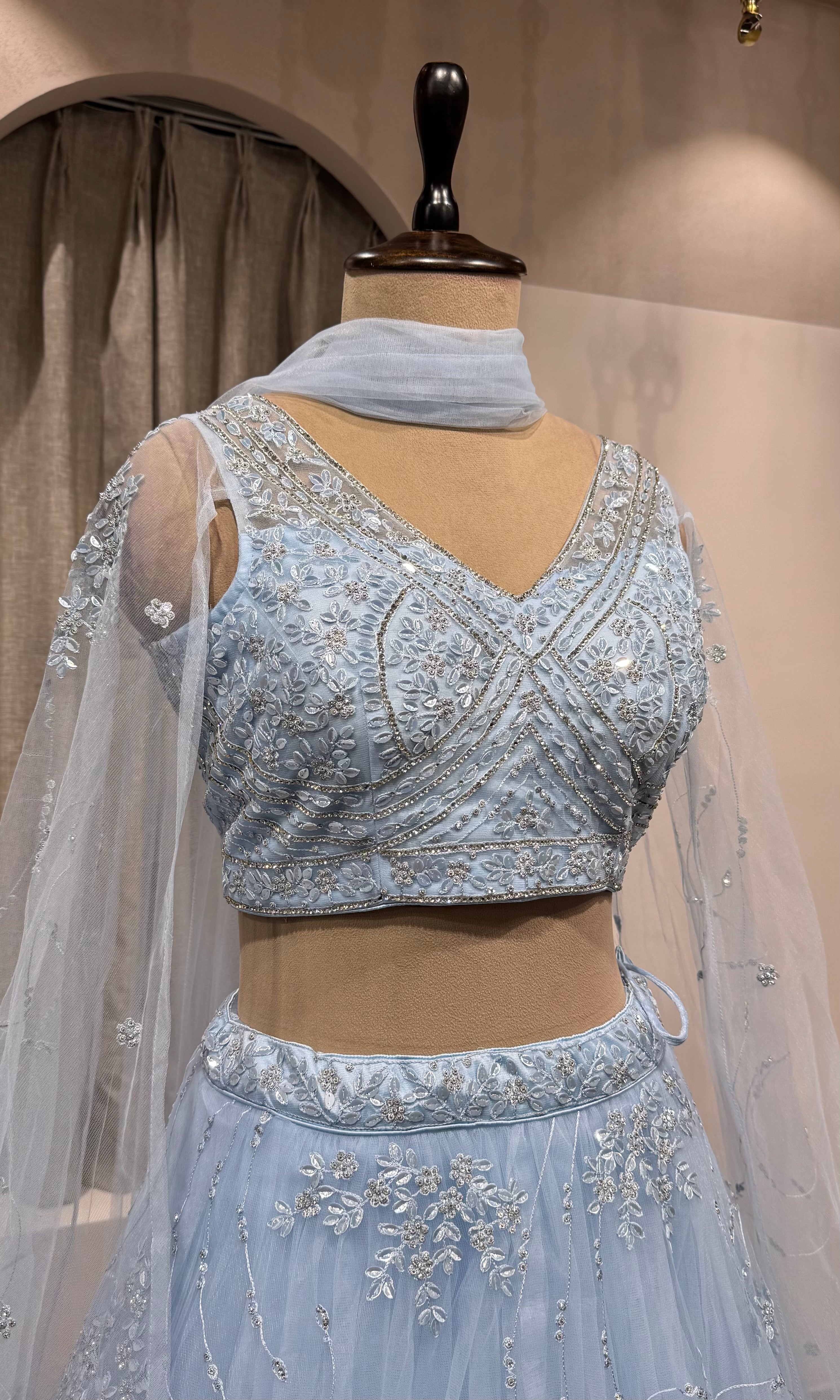 blue floral embroidered netted crop top lehenga