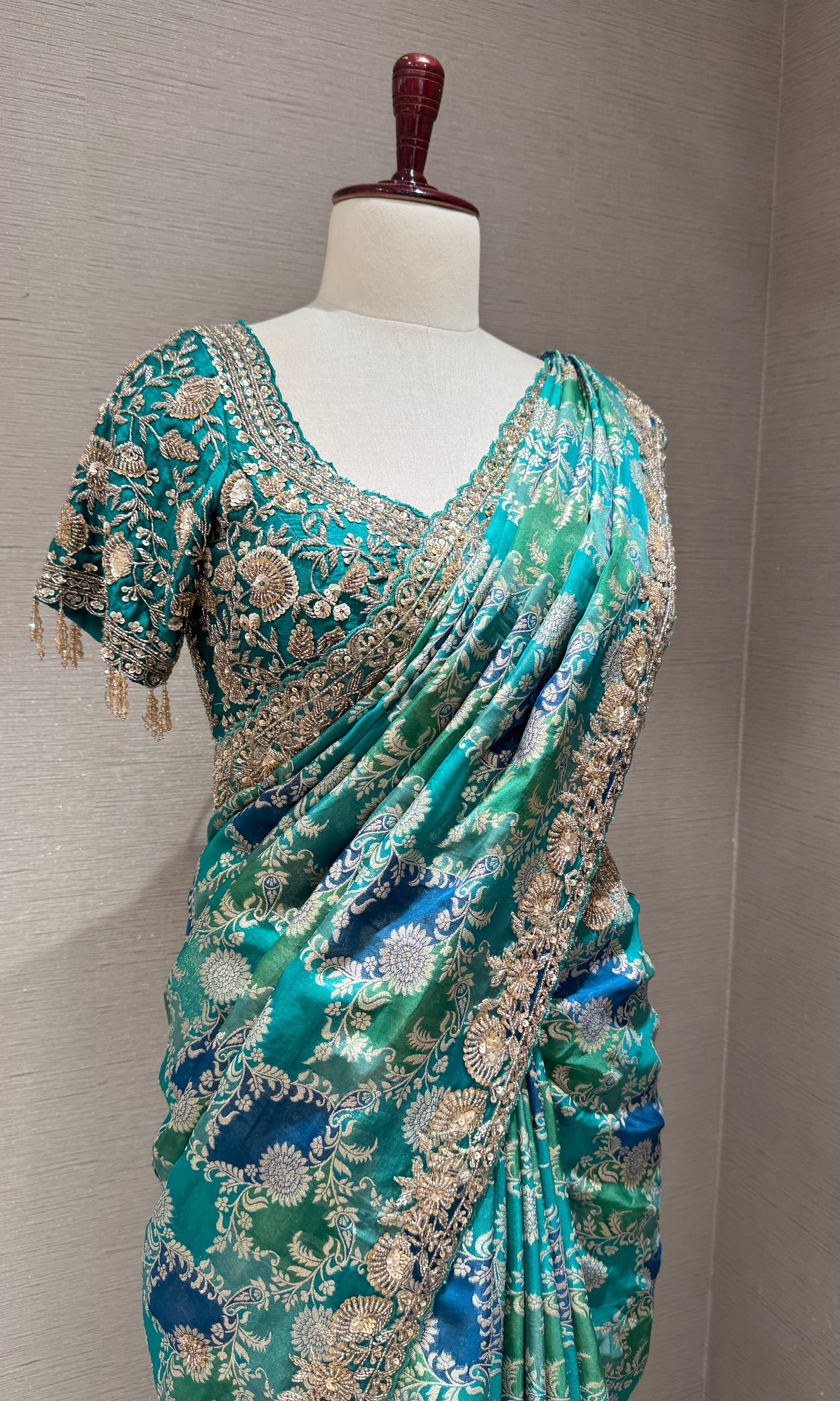 Green printed saree with an embellished Blouse