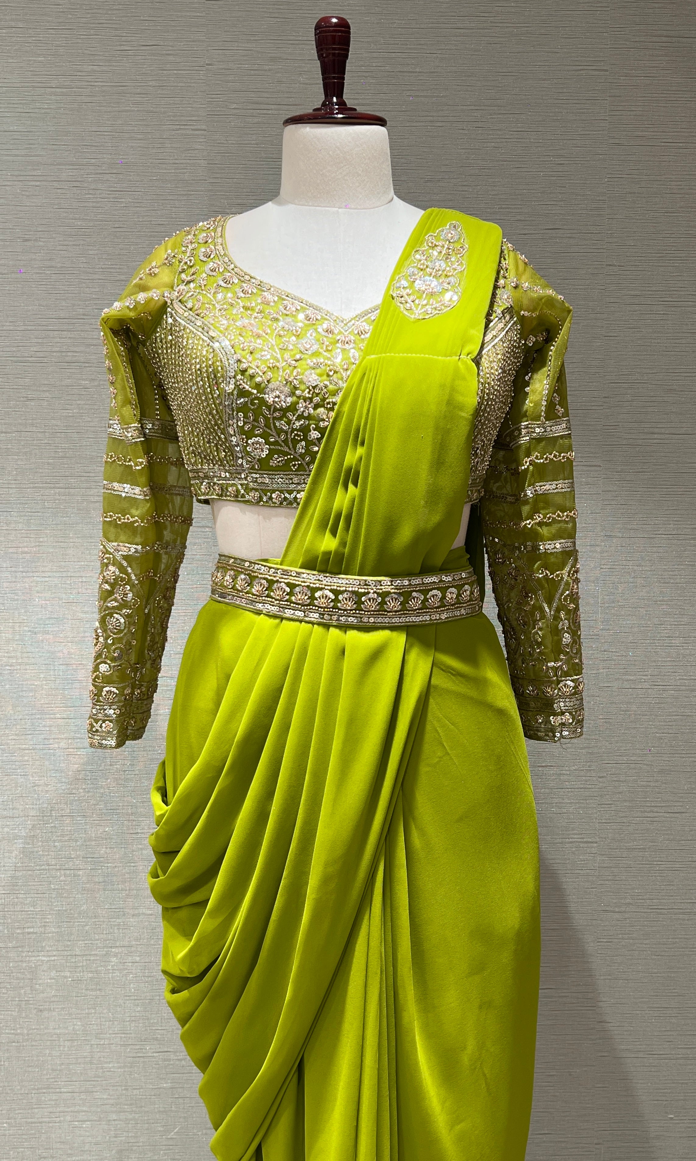 green draped saree with embellished blouse