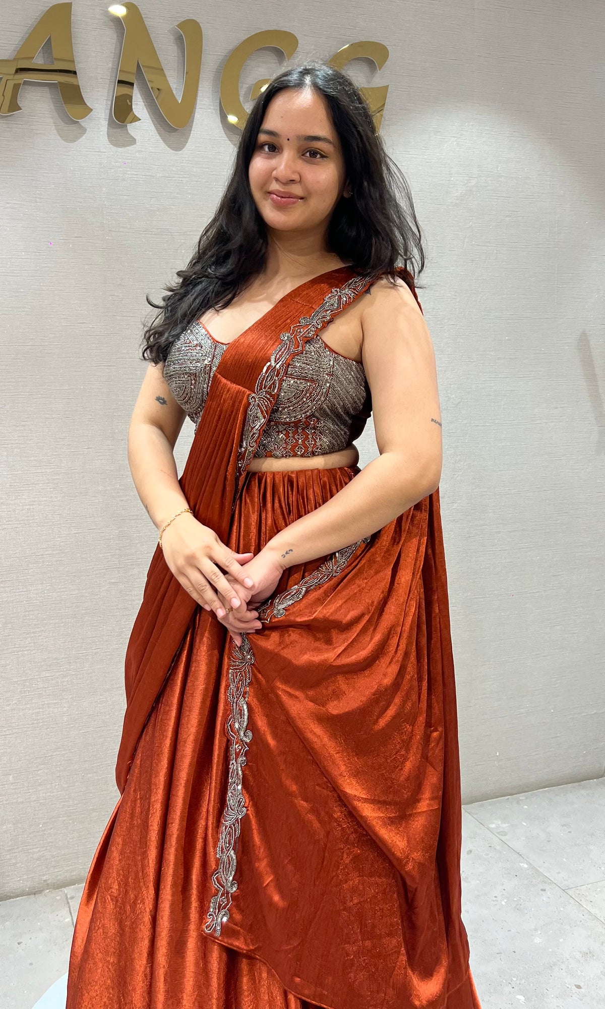 Rust Orange satin Draped lehenga with Silver embroidered Blouse