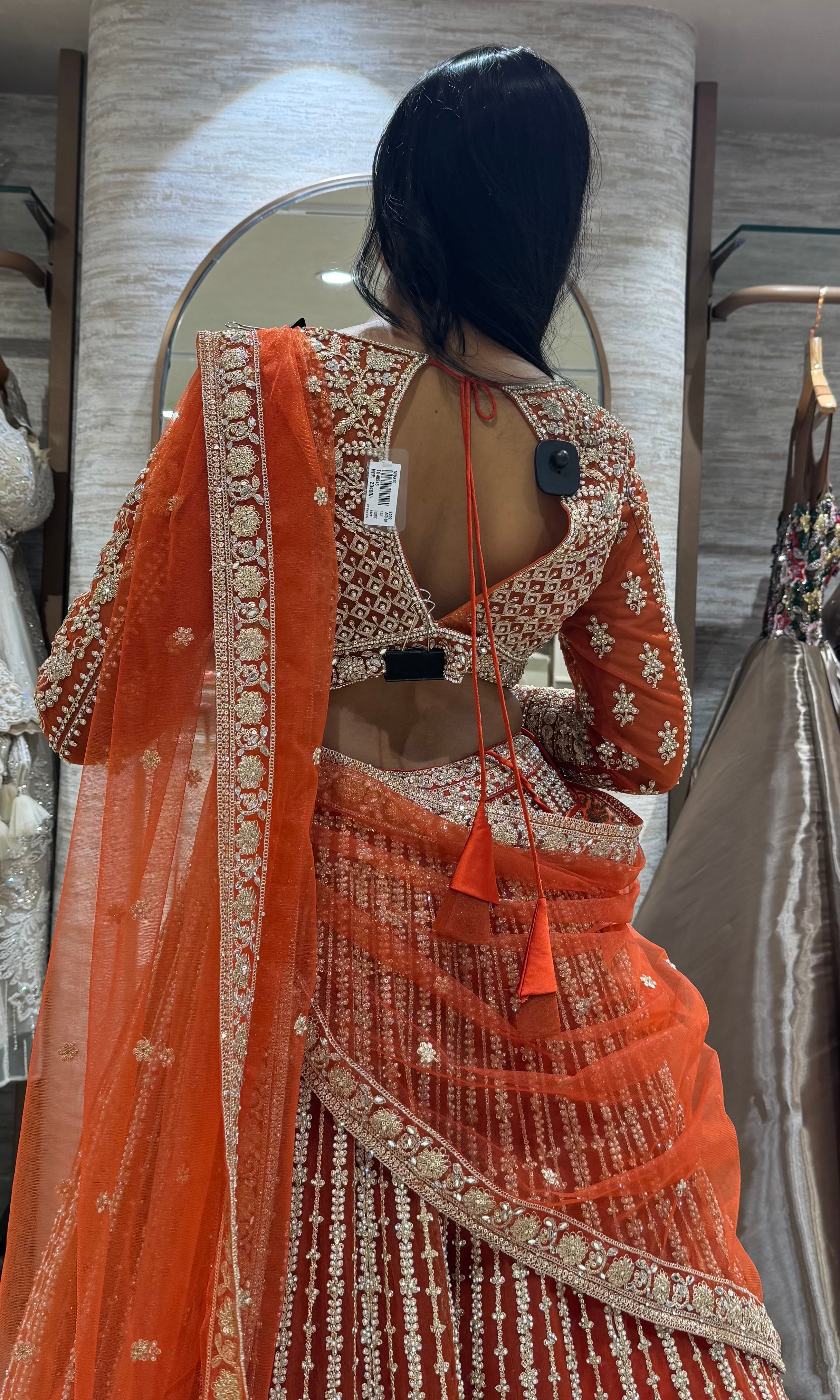 rust and white intricate embroidery lehenga