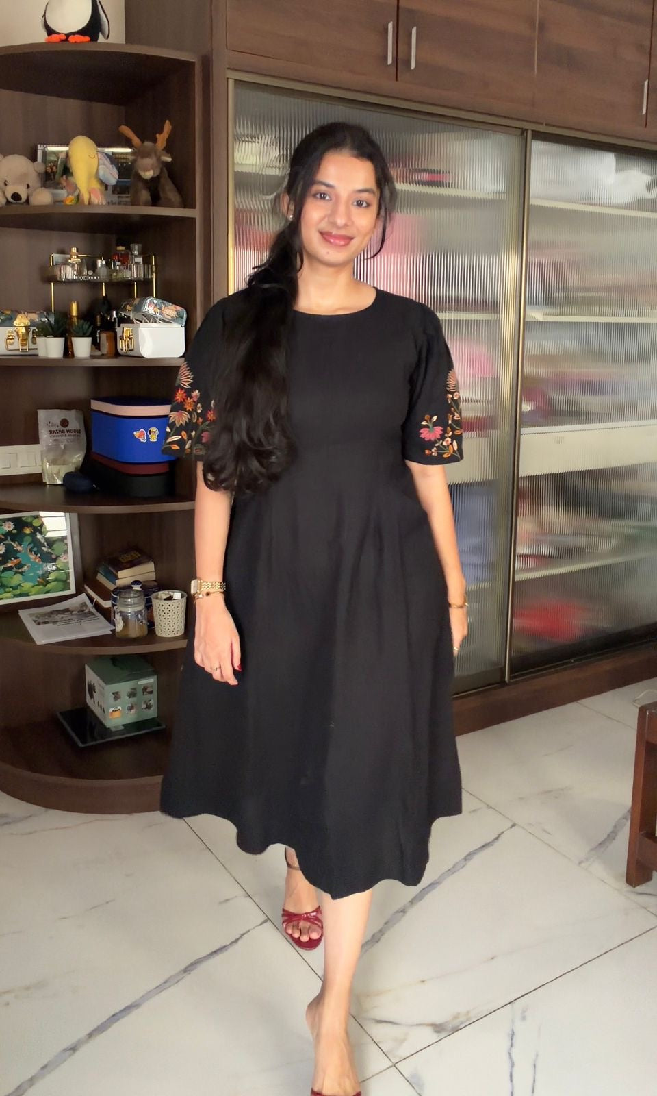 Black dress with embroidered puff sleeves