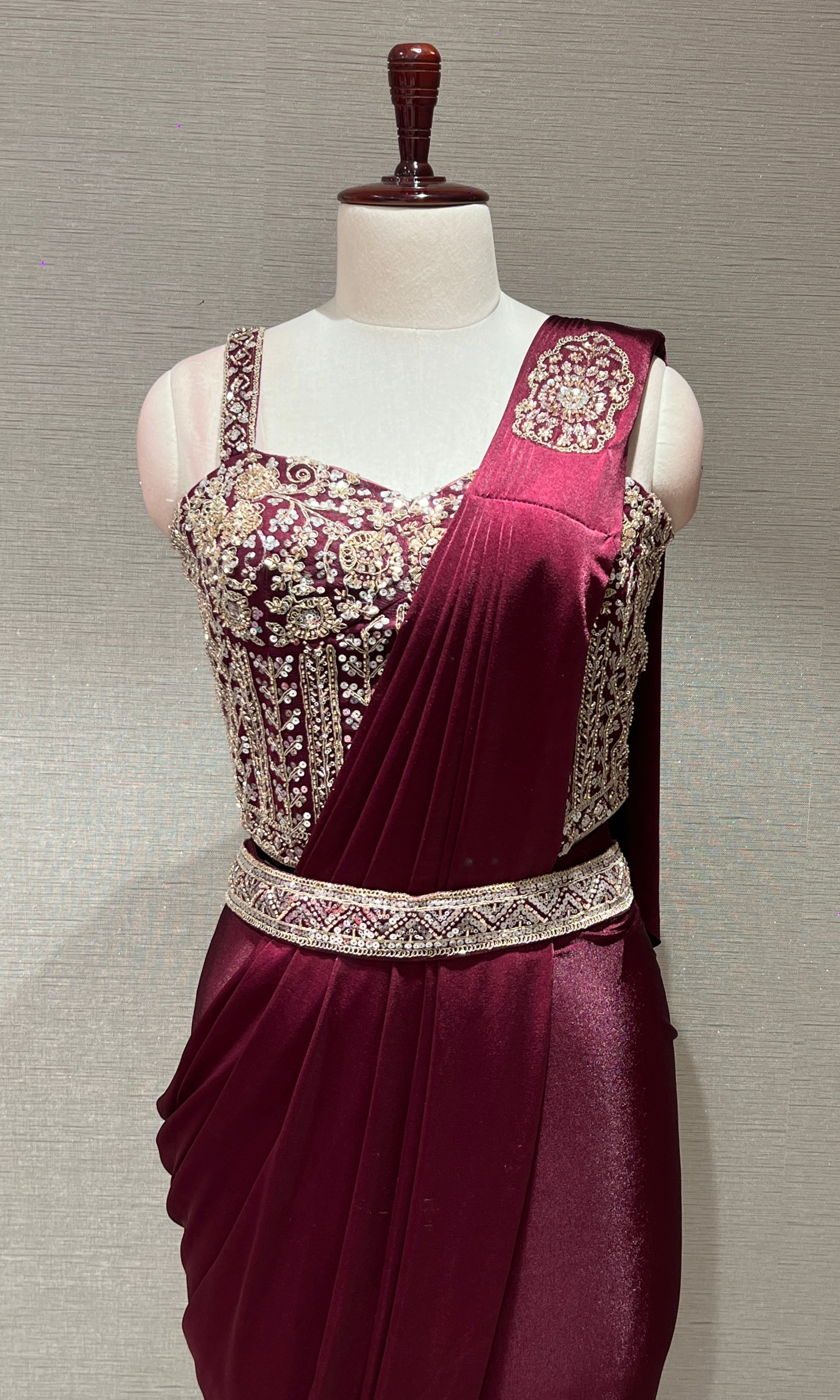 wine drape saree with corset blouse and belt