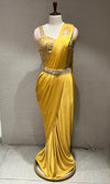 yellow drape saree with corset blouse and belt