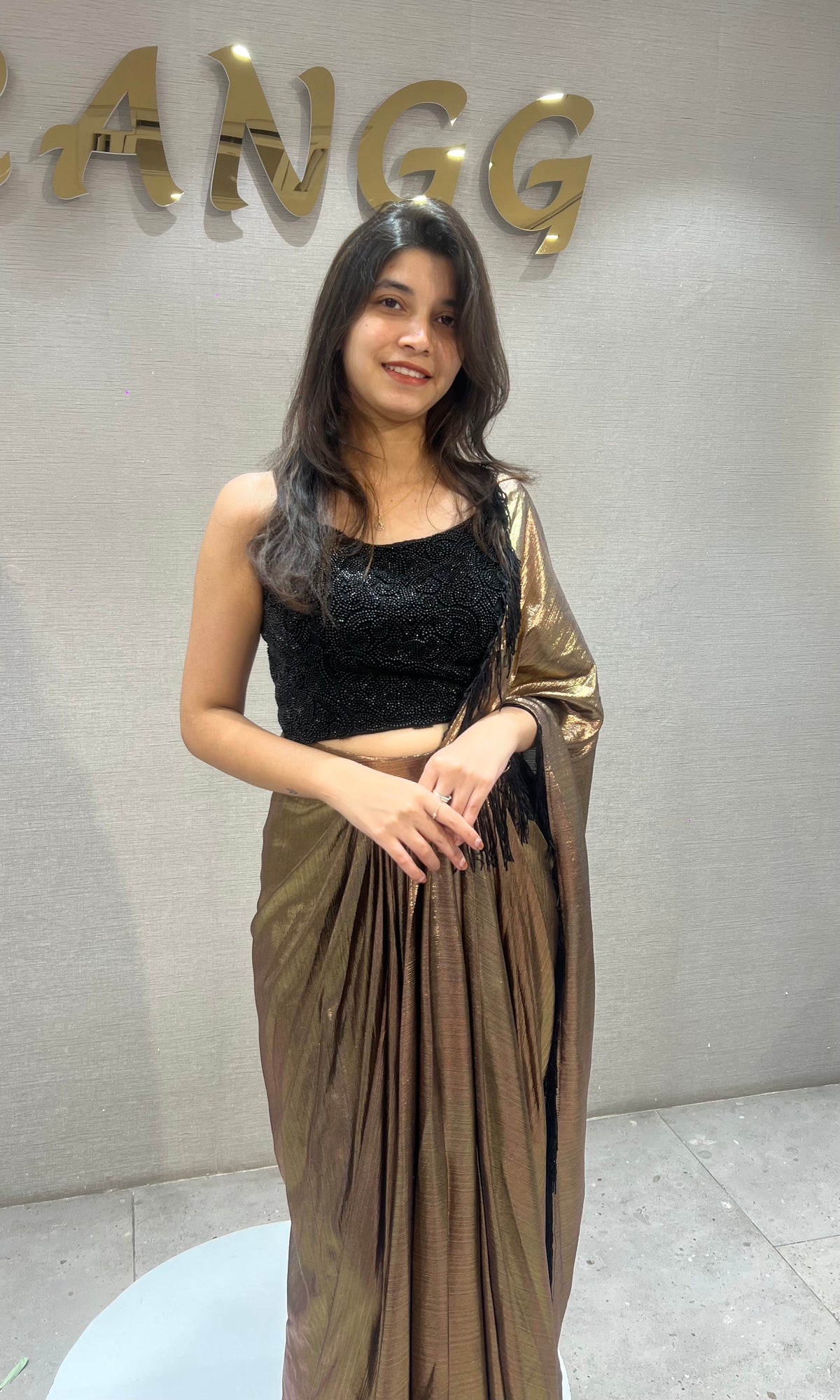 Metallic Brown Pleated Saree with Embroidered Black Blouse