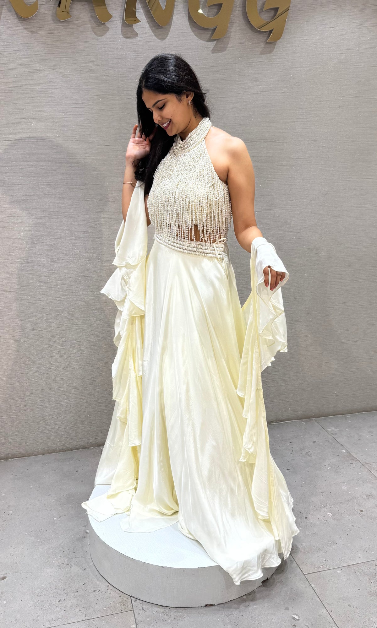 Cream Halter Lehenga with Beaded Fringe Ruffled Sleeves