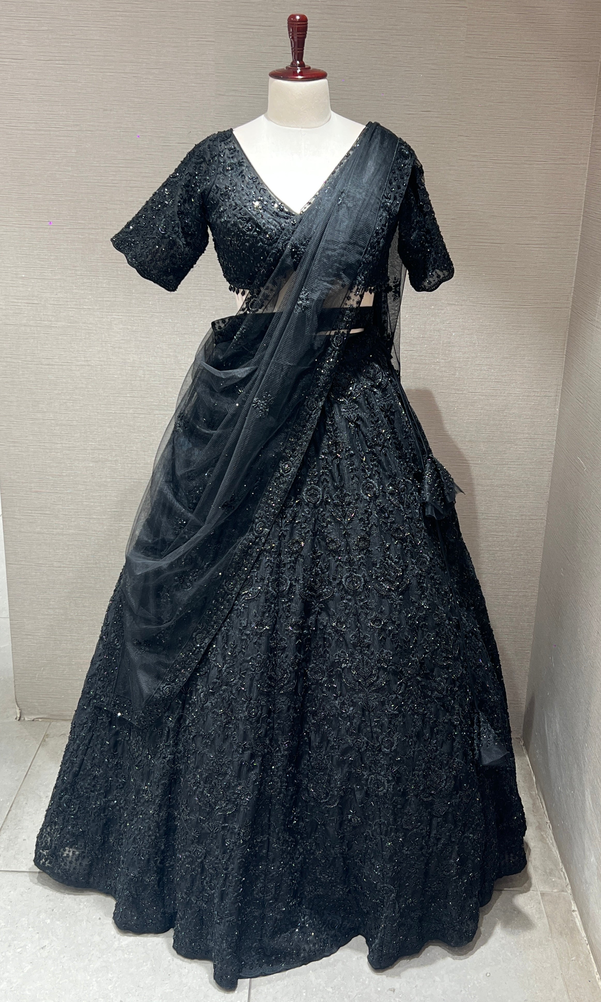Black lehenga with pretty blouse and netted dupatta
