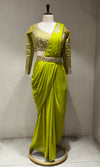 green draped saree with embellished blouse